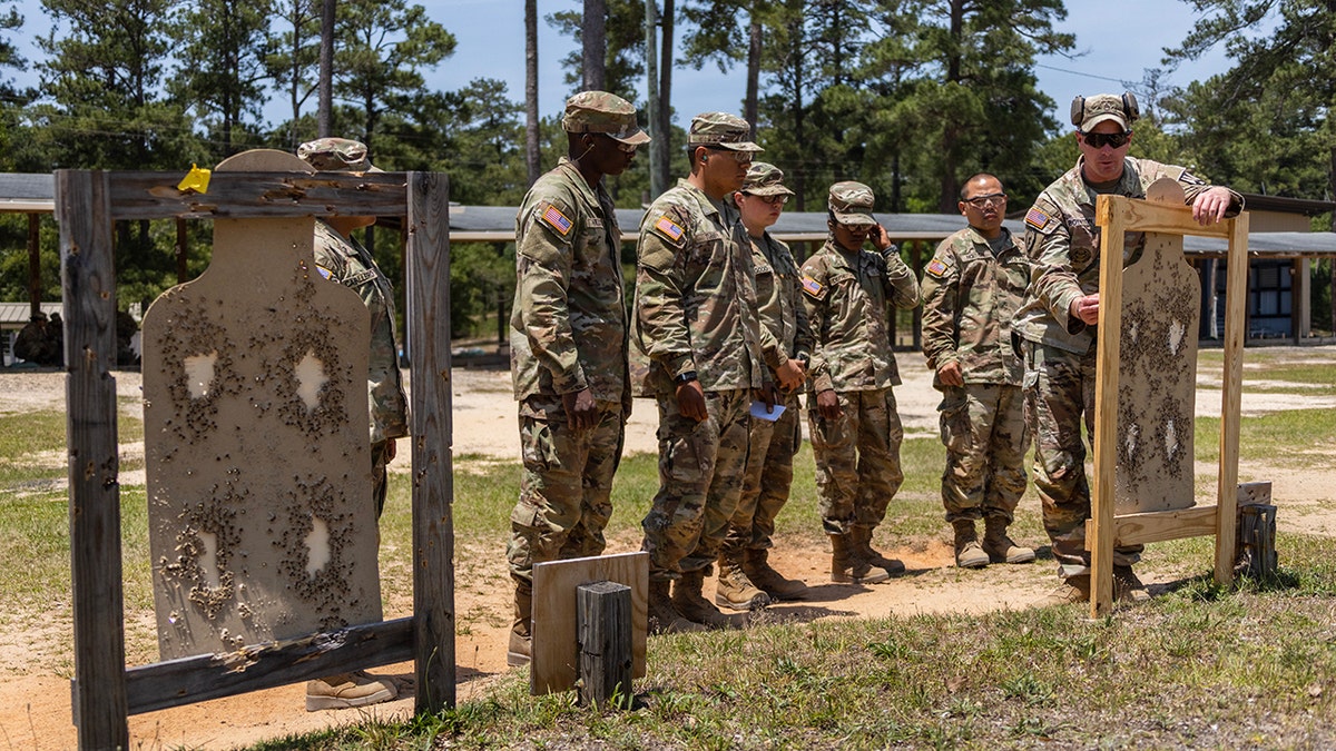 A group of Army recruits stand together during training.