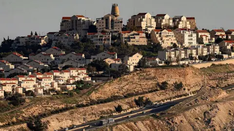 AFP via Getty Images Wide view of a highway near the Israeli settlement of Maale Adumim in the area of the so-called E1 project in Jerusalem, in the occupied West Bank, taken in February 2026.