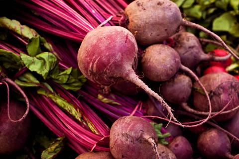 Whole, raw, fresh beets, with stems and roots