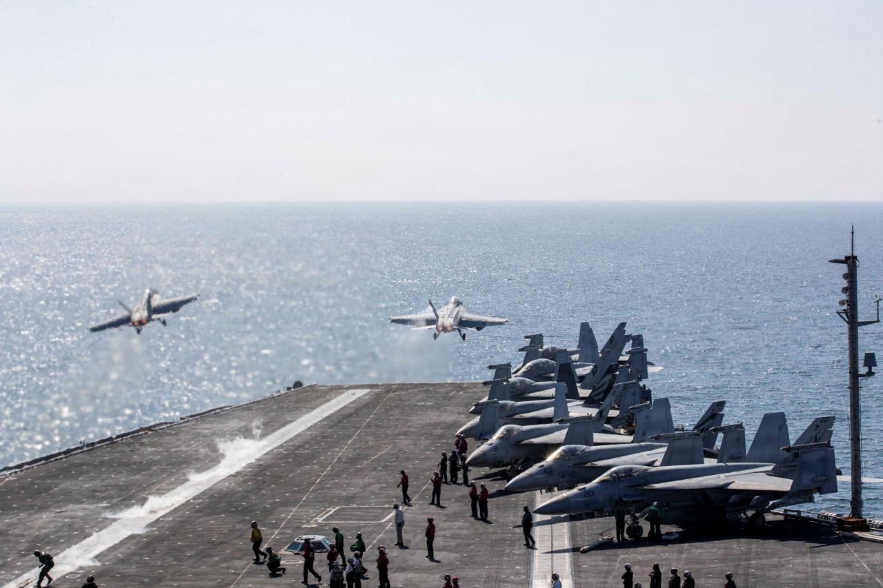 Two F/A-18 Super Hornets launch from the flight deck of the USS Abraham Lincoln on March 3.