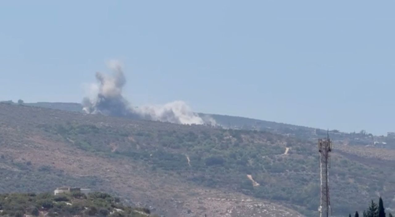 Smoke rises from a hill following Israeli air strikes, after the Israeli military issued an evacuation warning to the village of Al-Mansouri, Lebanon, on Wednesday in this screengrab obtained from social media.
