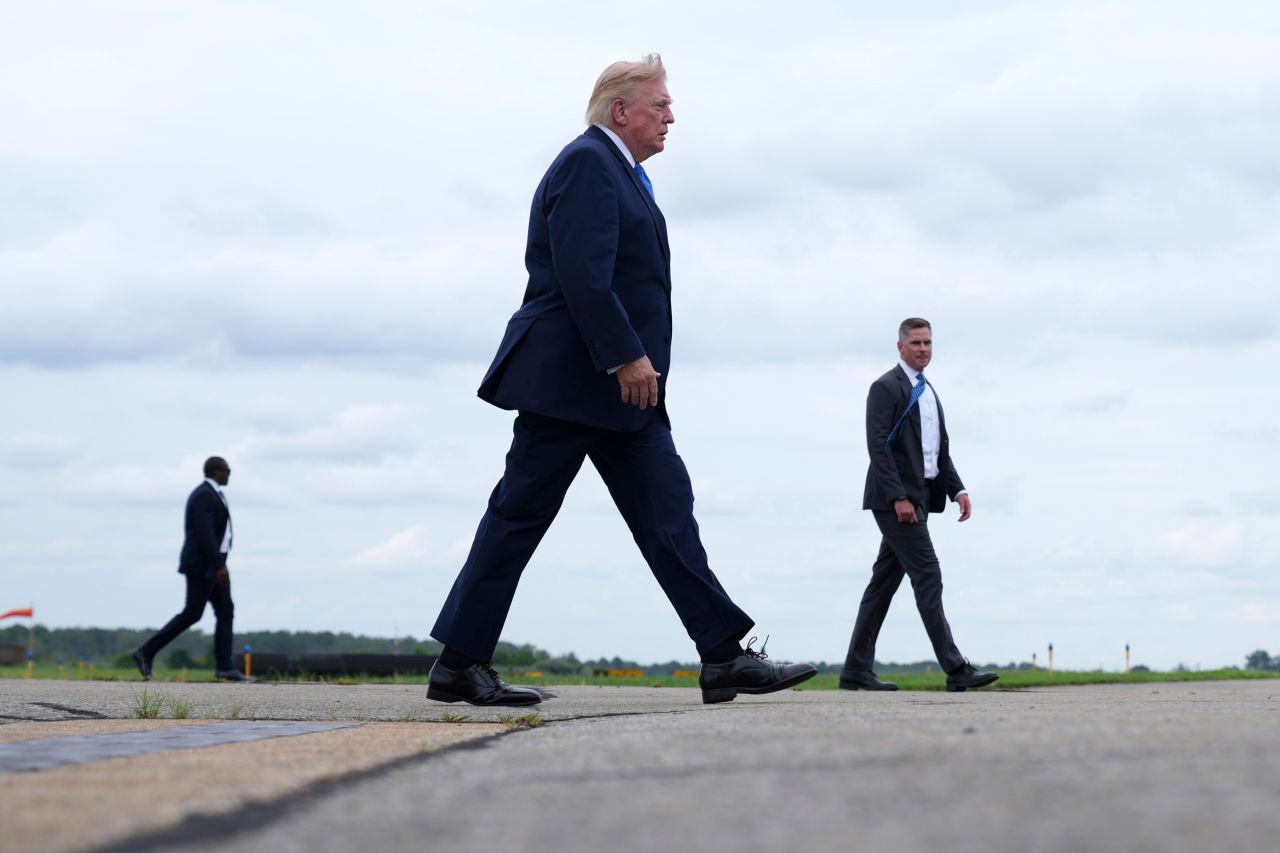 US President Donald Trump walks to board Air Force One at Morristown Municipal Airport in Morristown, New Jersey, on Sunday.