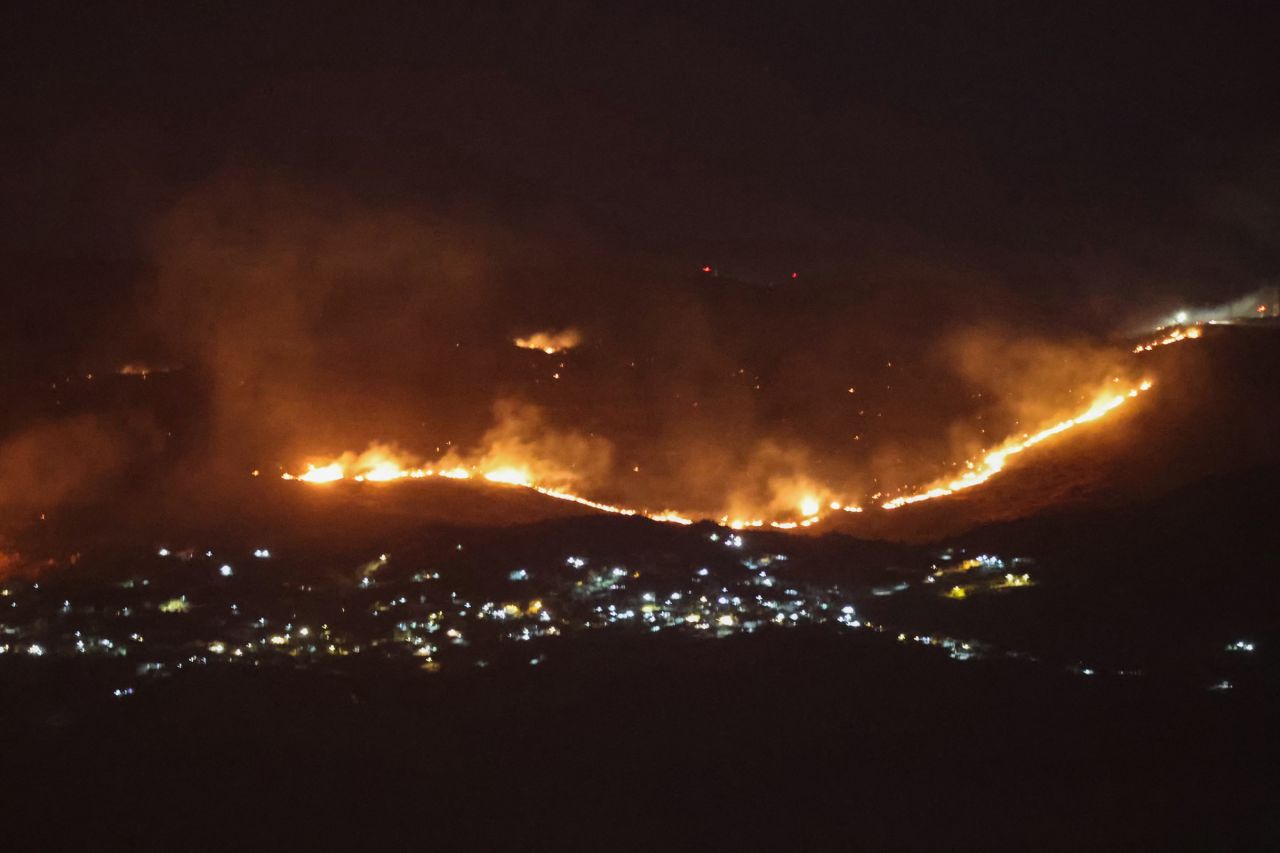 Forest fires sweep through the outskirts of the southern village of Kfar Shouba as a result of Israeli shelling that targeted the area, as seen from the southern Lebanese area of Marjayoun on Wednesday.