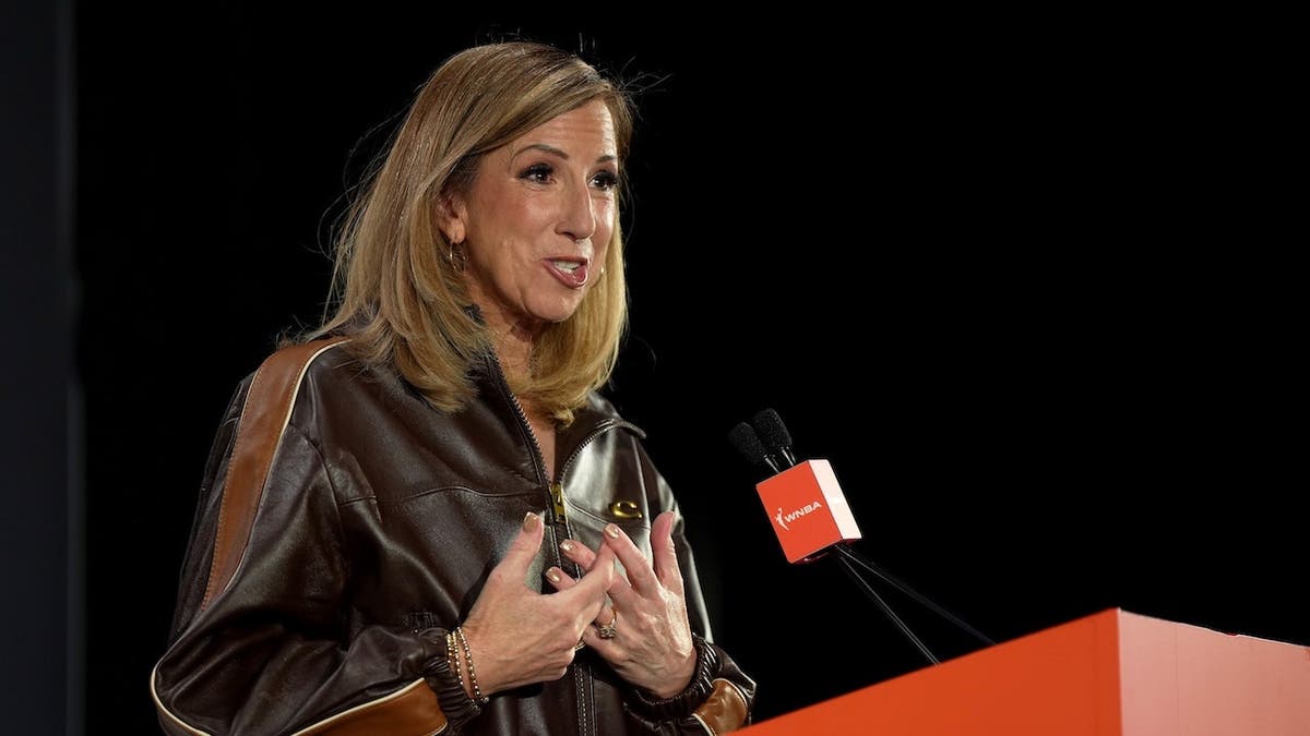 WNBA Commissioner Cathy Engelbert speaks at a podium before the 2026 WNBA Draft.