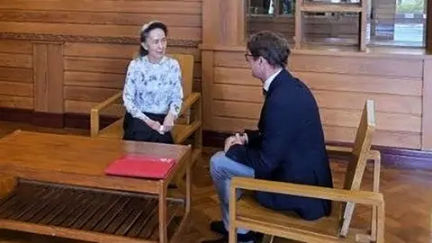 Myanmar Military Information Committee Former Myanmar president Aung San Suu Kyi talks to Arnaud de Baecque, resident representative of the International Committee of the Red Cross (ICRC)
