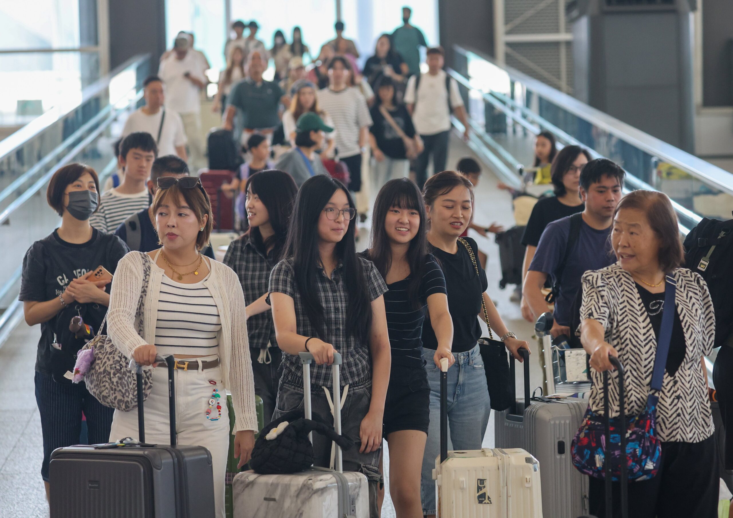 Travellers at Hong Kong International Airport. Hongkongers are becoming more open to services from the mainland due to improvements in airlines and airports, Miramar Travel’s Alex Lee says. Photo: Edmond So