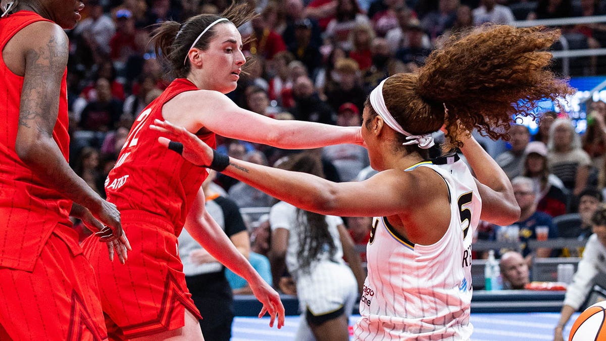 Caitlin Clark fouling Reese