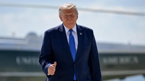Reuters U.S. President Donald Trump gives thumbs-up as he walks from Marine One to board Air Force One.