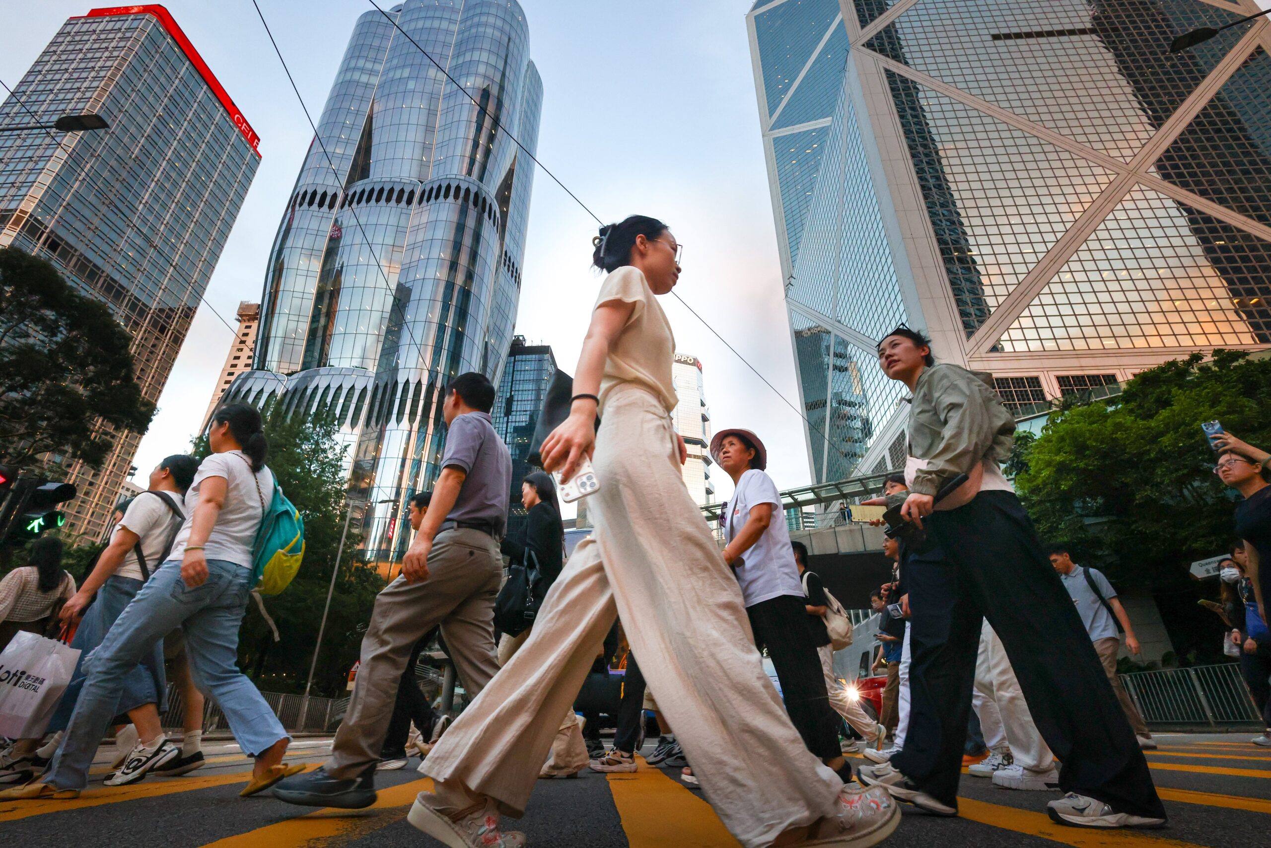Pedestrians in Hong Kong’s central business district. Finance chief Paul Chan has said authorities will revise the city’s annual GDP forecast later this month. Photo: Dickson Lee