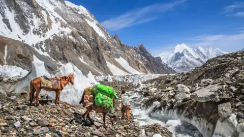 Getty Images Horseman on Godwin-Austen glacier, returning from K2 base camp to Concordia, northern Pakistan