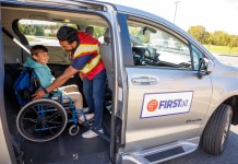 A student in a wheelchair being secured in a FirstAlt van. (Photo courtesy of First Student.)