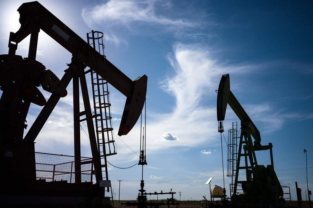 Oil pump jacks are shown in a field in Stanton, Texas on June 27, 2024.