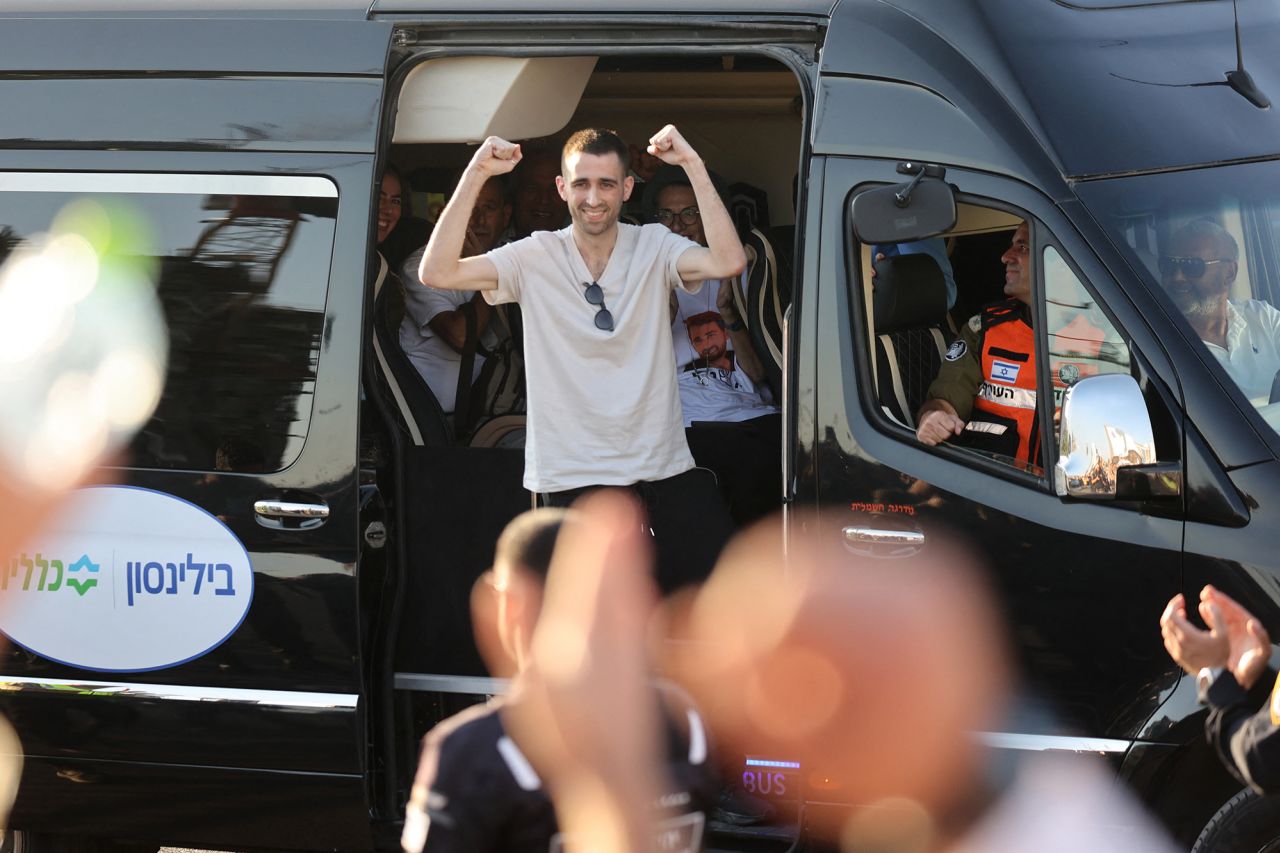 Released Israeli hostage Avinatan Or greets well-wishers upon arriving at Beilinson Hospital in the Rabin Medical Centre in Petah Tikva in central Israel on October 13, 2025.