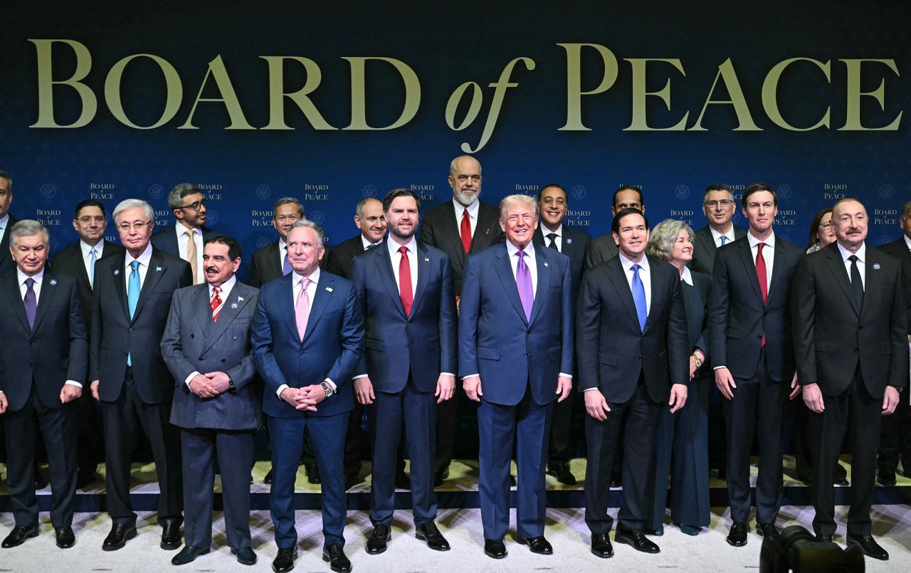 US President Donald Trump, center, flanked by US Vice President JD Vance, left, and US Secretary of State Marco Rubio, right, joins leaders for a group photo during the inaugural meeting of the "Board of Peace" at the US Institute of Peace in Washington, DC, on February 19.