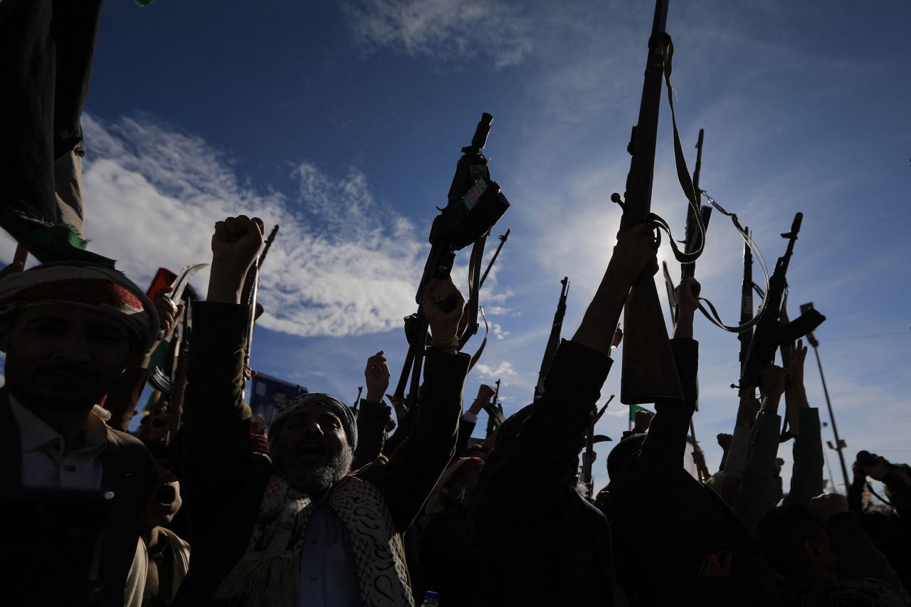 Houthis brandish their weapons as they rally in solidarity with Iran and Lebanon in the Yemeni capital Sanaa on March 27.