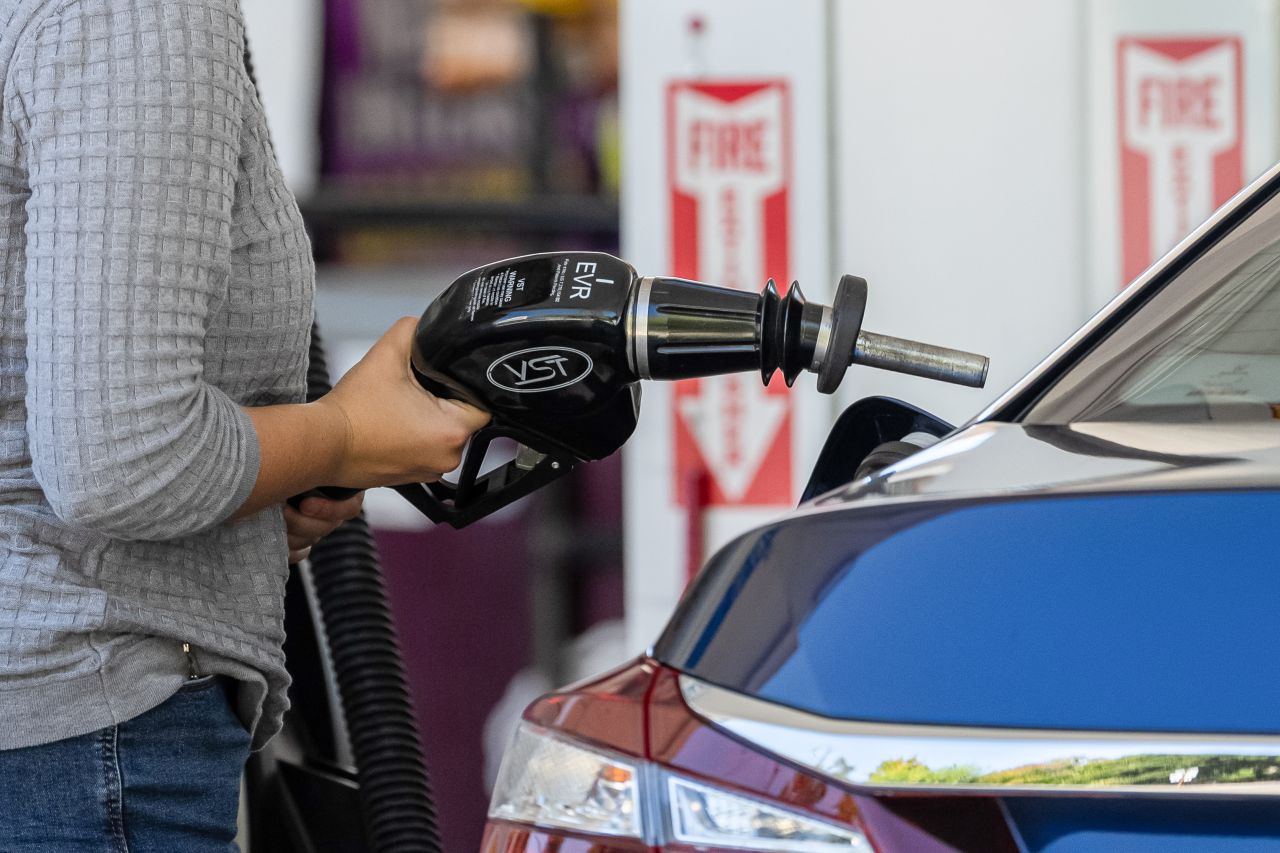 A driver refuels a vehicle at a Shell gas station in Palo Alto, California, on Tuesday, July 21.