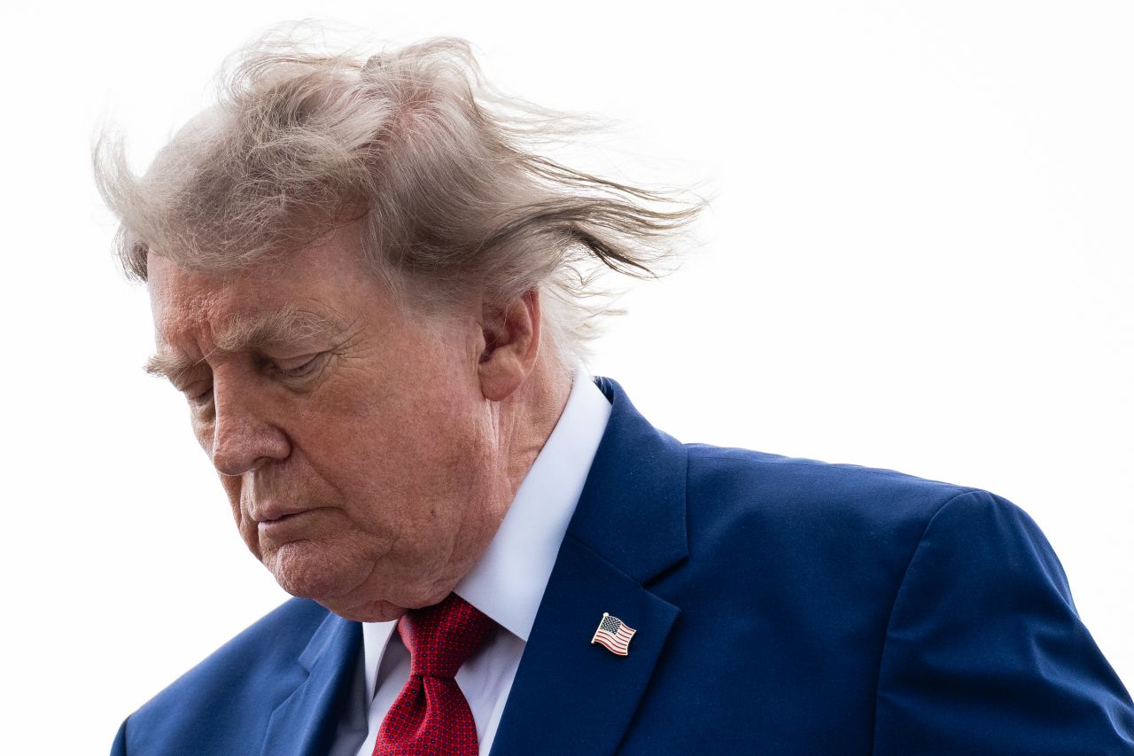 President Donald Trump walks off of Air Force One at Newark Liberty International Airport on August 7.