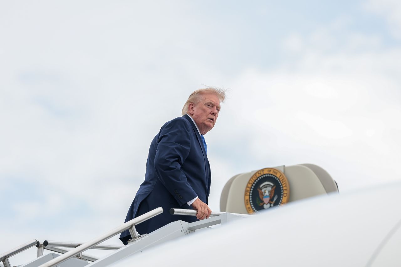President Donald Trump boards Air Force One at Morristown Municipal Airport in Morristown, New Jersey, on Sunday.
