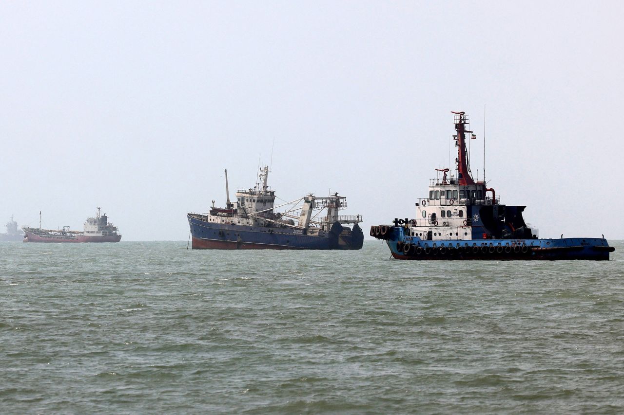 Vessels transit the Strait of Hormuz off Bandar Abbas in southern Iran on Monday.