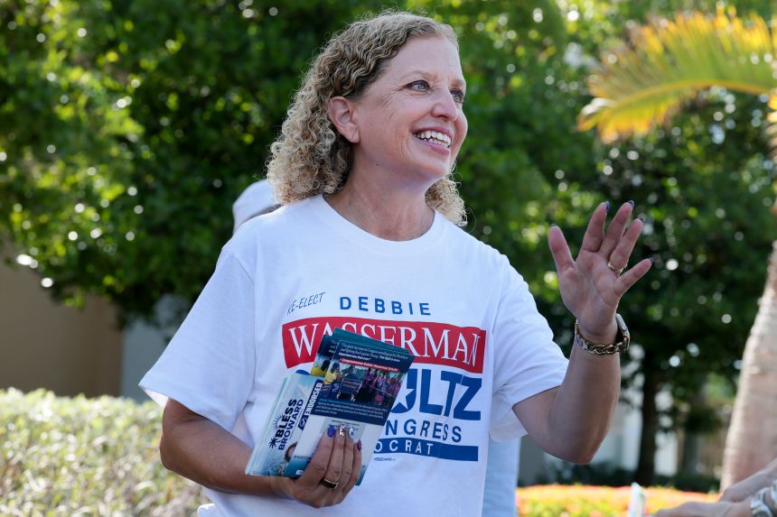 Rep. Debbie Wasserman Schultz campaigns outside of the Kings Point Clubhouse polling station in Tamarac, Florida, on Tuesday.