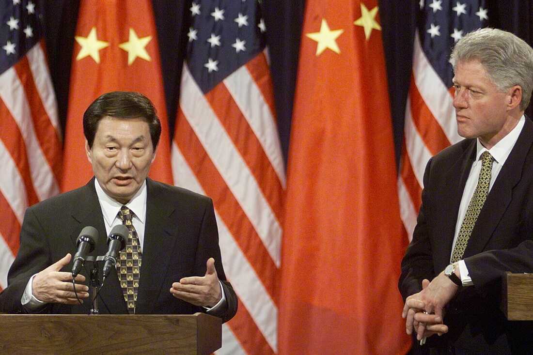 Zhu Rongji (left) answers reporters' questions during a joint news conference with then-President Bill Clinton on April 8, 1999, in Washington, D.C.