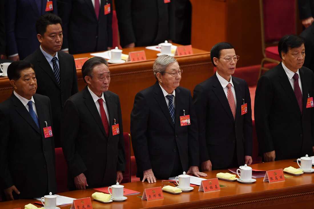 Chinese leaders and former leaders including Zhu Rongji (center) listen to The Internationale at the end of the closing session of the 19th Communist Party Congress at the Great Hall of the People in Beijing on Oct. 24, 2017.