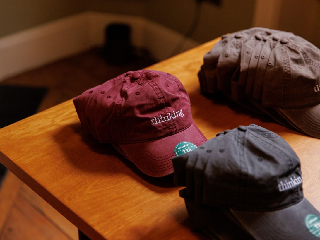 Anthropic's "Thinking" baseball caps were one of the most popular pieces of AI merch, and were a way to make the company feel more human.