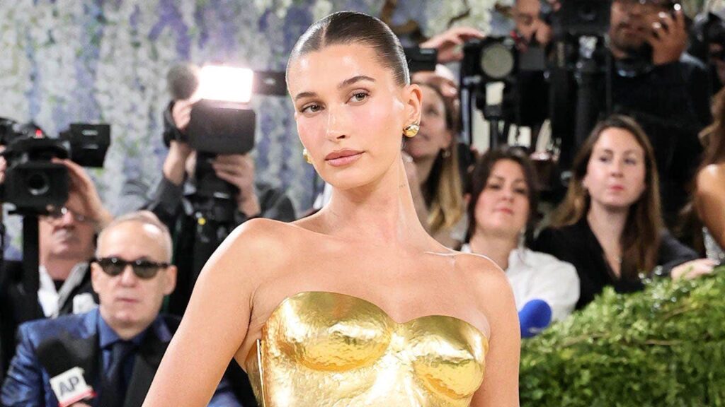 Hailey Bieber shows off toned figure in tiny yellow bikini while sharing summer snaps Hailey Bieber shows off toned figure in tiny yellow bikini while sharing summer snaps