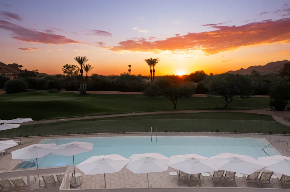A swimming pool at sunset