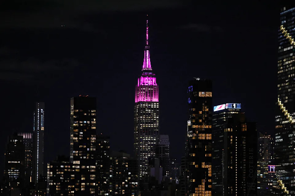The Empire State Building is lit up in pink to honor the late US singer-songwriter Dolly Parton in New York on August 25, 2026. Dolly Parton, the American country music singer who rose from poverty in Tennessee to become a US cultural giant with hits like "Jolene" and "9 to 5," has died at 80, her family said on August 25. (Photo by Leonardo MUNOZ / AFP via Getty Images)