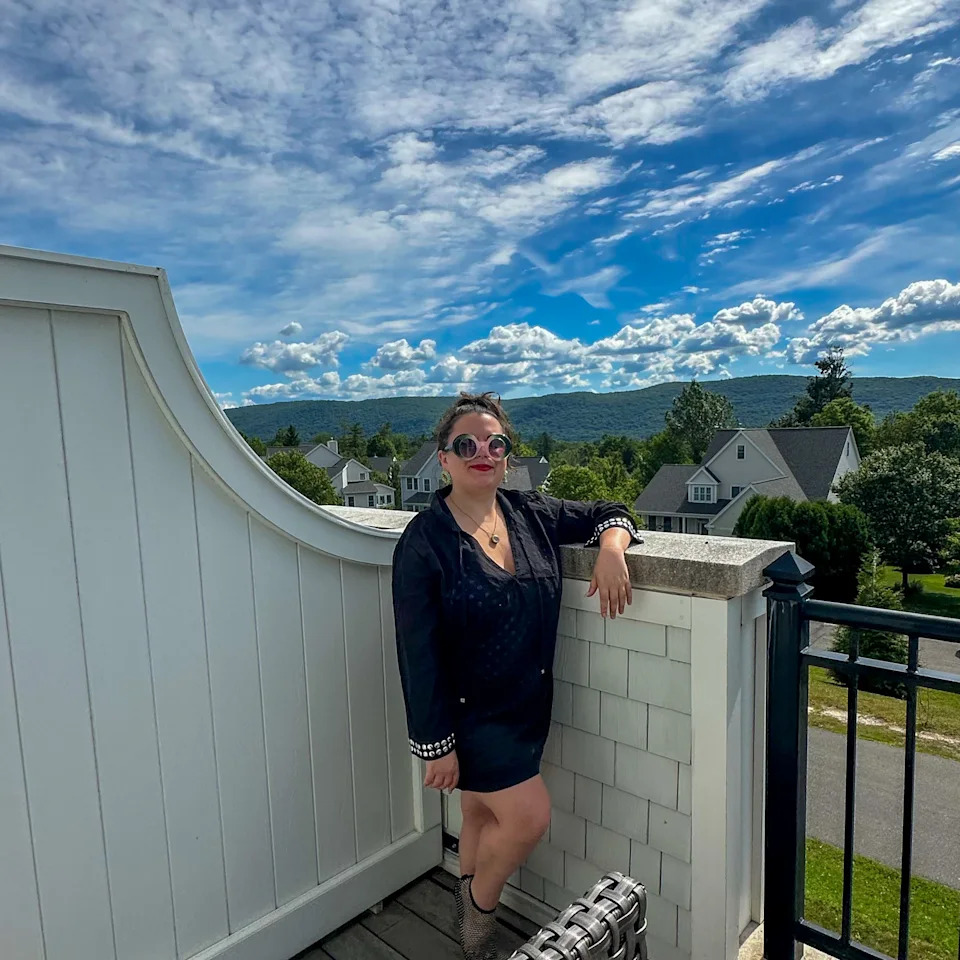 Woman on balcony at a Lenox, MA wellness resort
