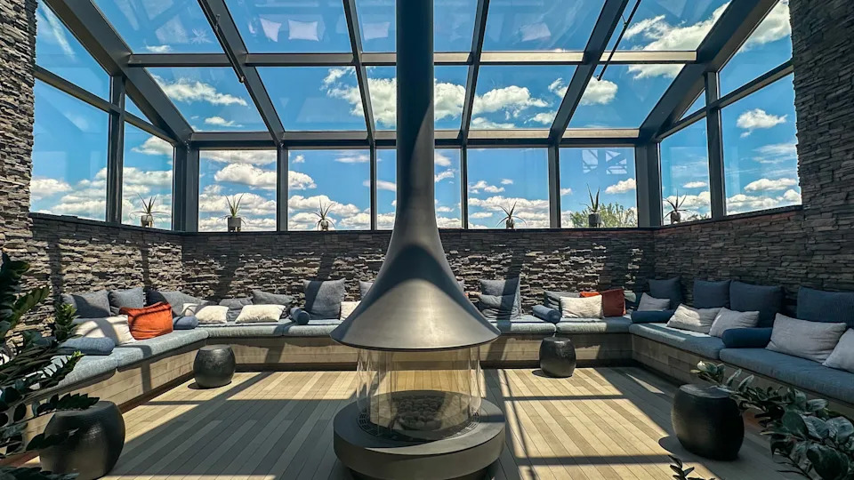 Sunny room with a sun roof, pillows, and couch