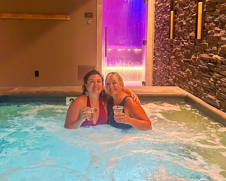 Woman and daughter in a hot tub at a spa in Massachusetts
