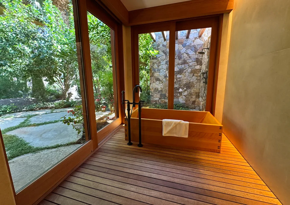 The elegant wooden in-room bathtub