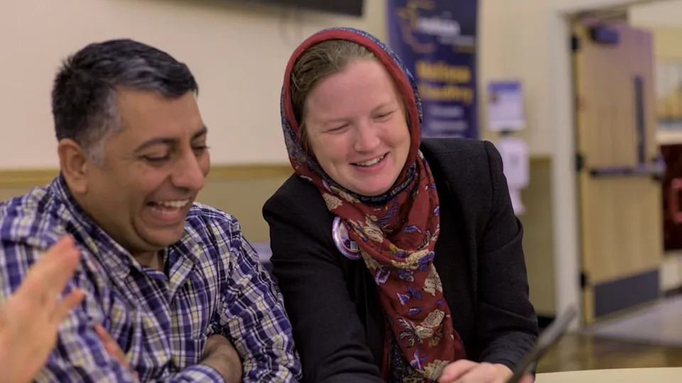 Melissa Chaudhry embraces husband during campaign event