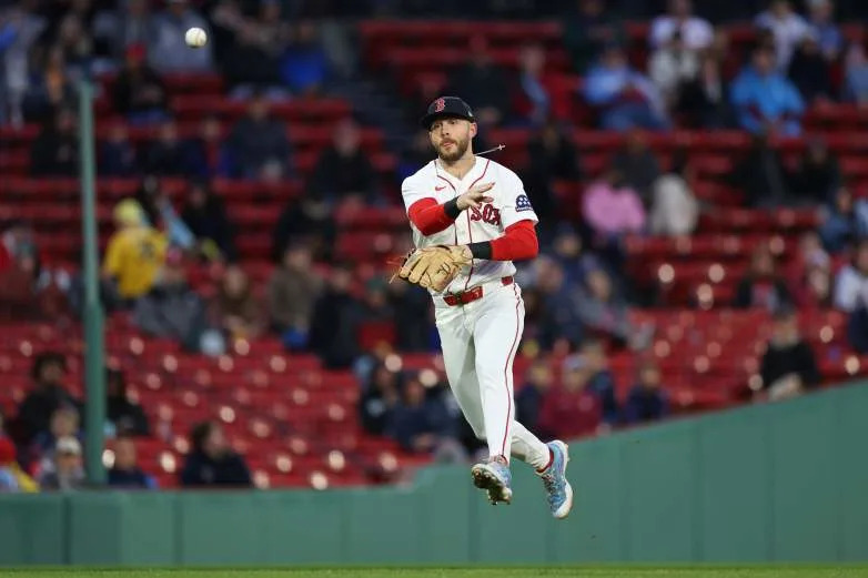 BOSTON, MASSACHUSETTS - MAY 14: Trevor Story #10 of the Boston Red Sox throws to first during the fourth inning against the Philadelphia Phillies at Fenway Park on May 14, 2026 in Boston, Massachusetts. (Photo by Paul Rutherford/Getty Images)