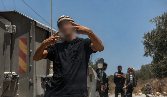 A young settler in the Palestinian village of Jalud. What makes these so-called hilltop youth so happy?