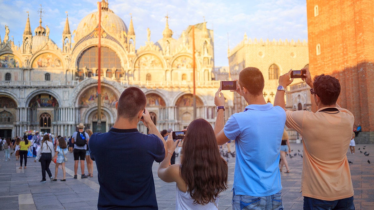 Tourists taking pictures in Venice