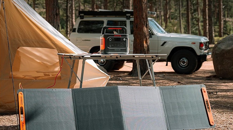 Jackery Explorer power station on a camping table.