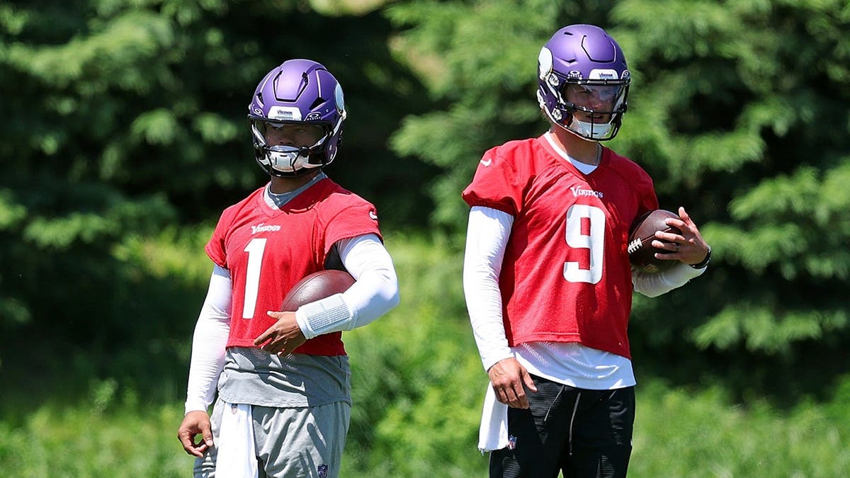 Kyler Murray and J.J. McCarthy standing during an OTA workout in Eagan Minnesota