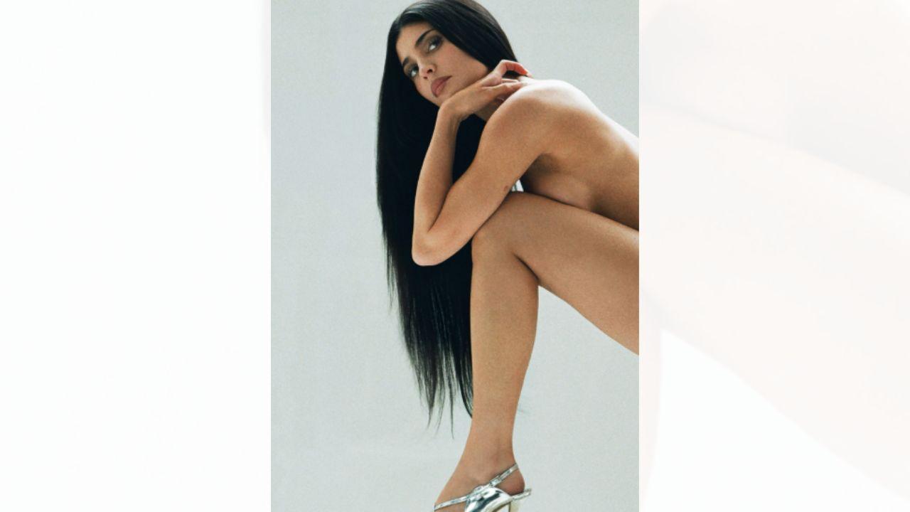 Image of Kylie Jenner strategically covered her assets with her long black hair.