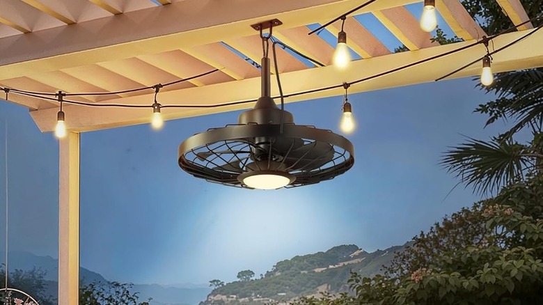 Ceiling fan attached to the underside of a pergola