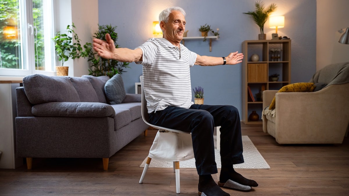 Older man sitting in chair