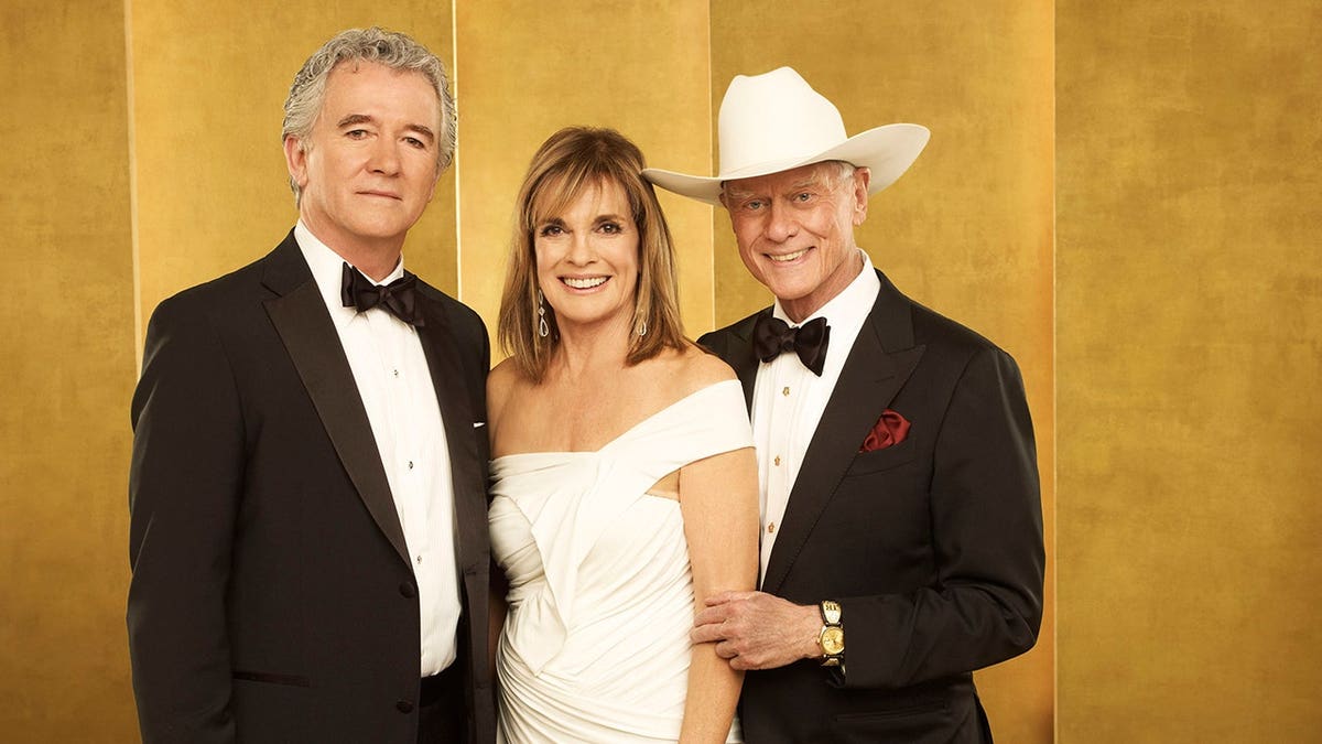 Patrick Duffy, Linda Gray and Larry Hagman pose together at an awards ceremony.