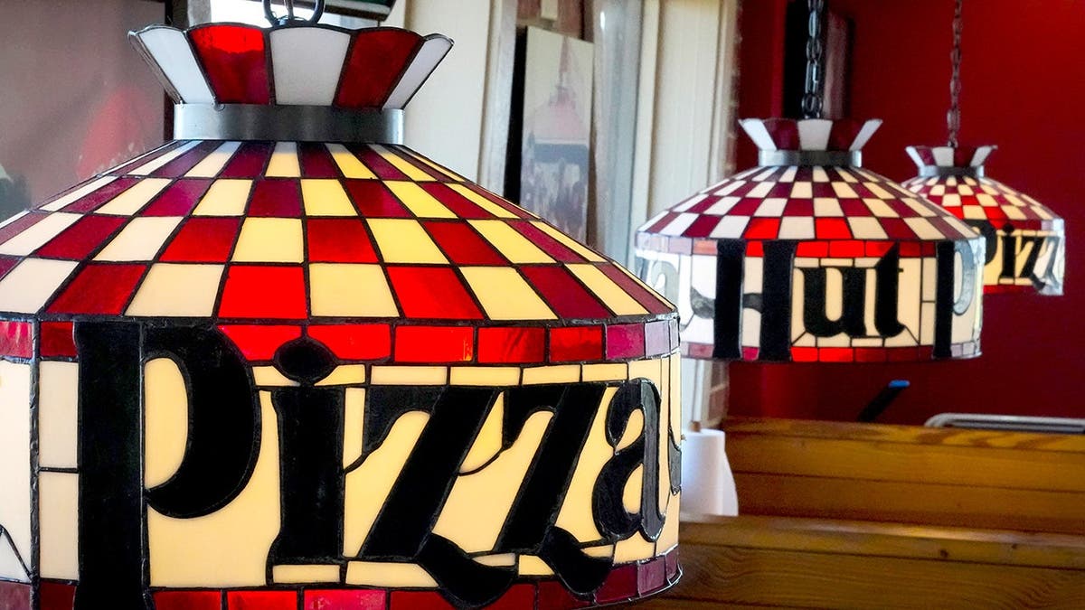 A row of Tiffany lampshades at a Pizza Hut Classic.