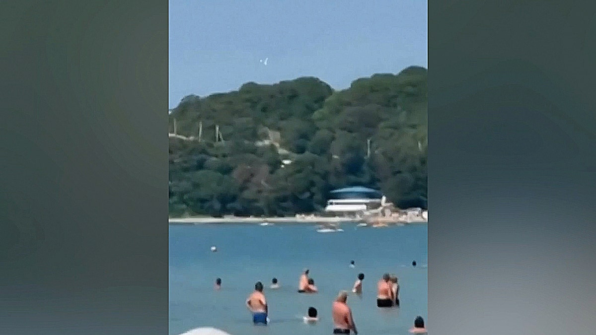 Object flying in blue sky