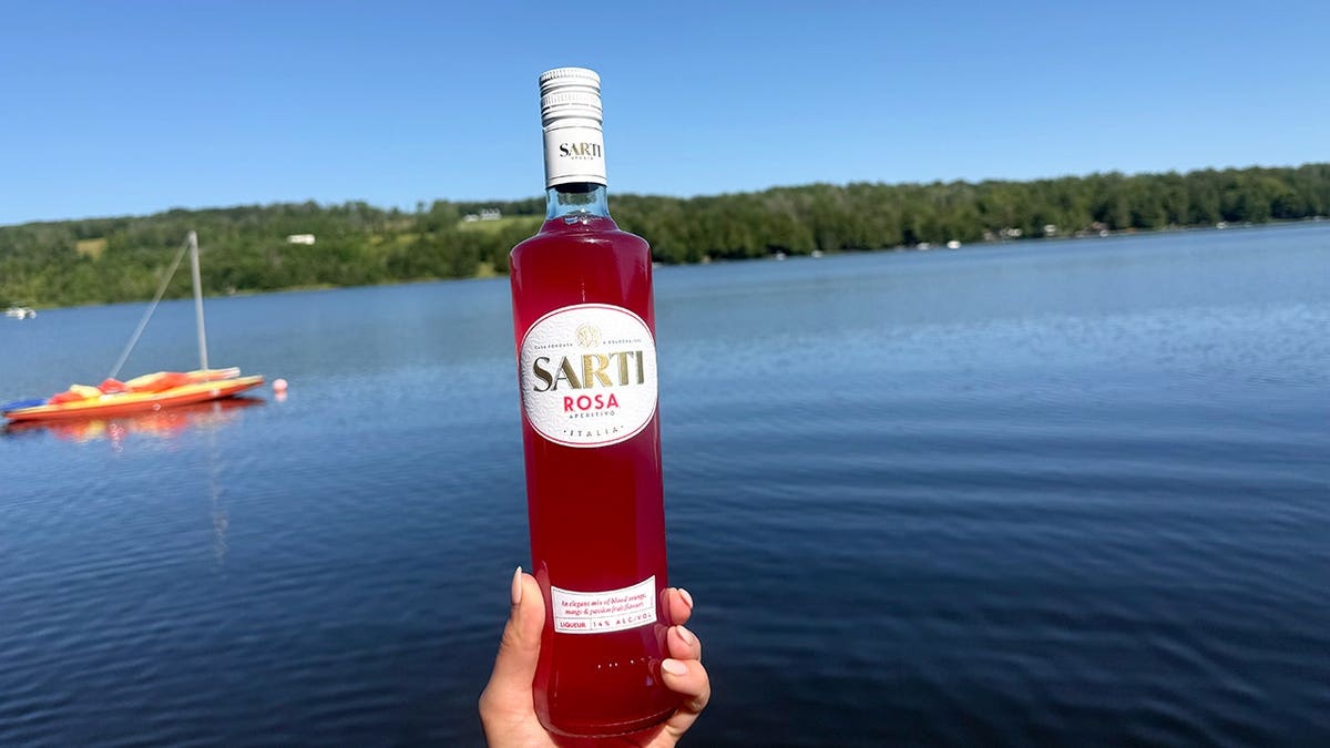 sarti rosa bottle on a lake