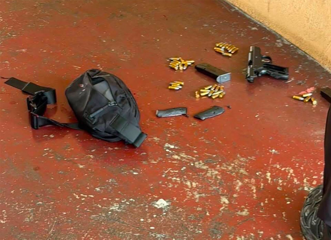 A photo appears to show the shooter's gun, inside the school building.