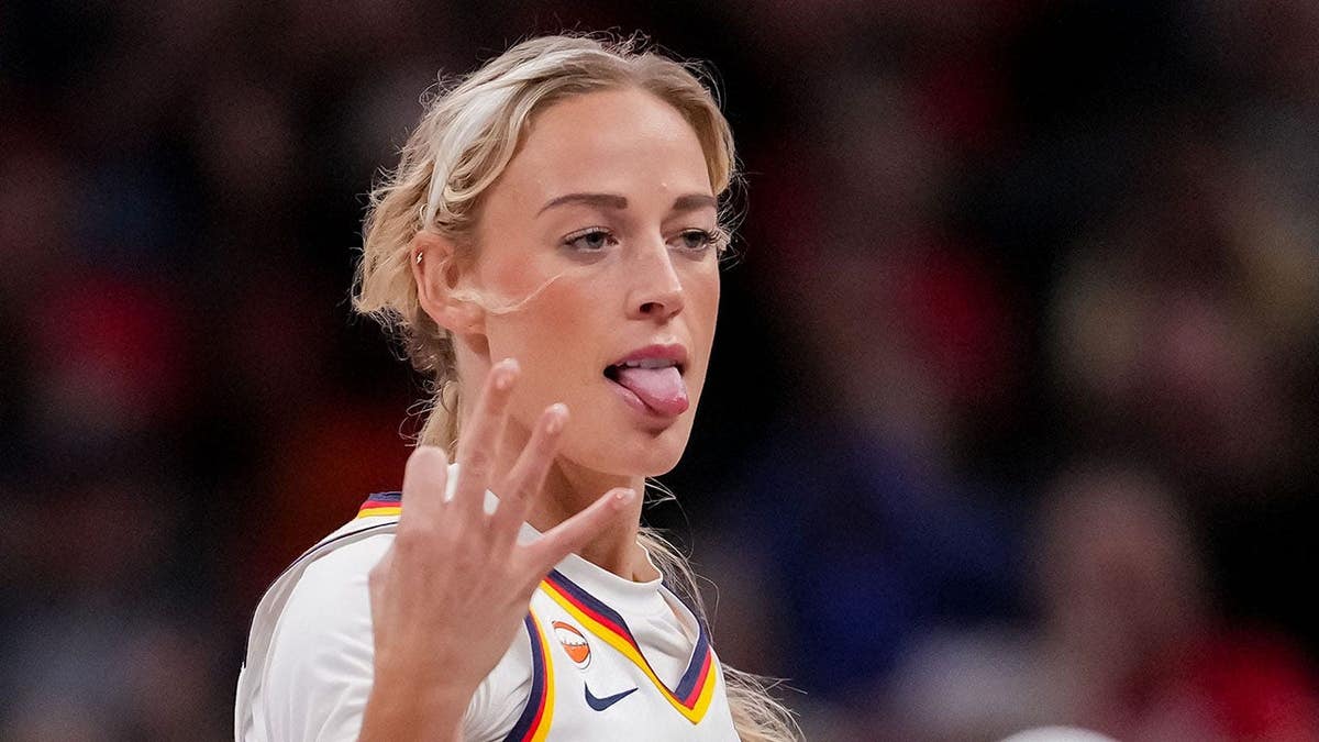 Sophie Cunningham celebrates a three-point basket during an Indiana Fever game.