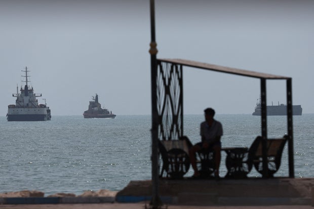 Vessels in the Strait of Hormuz are visible near the beach of Bandar Abbas